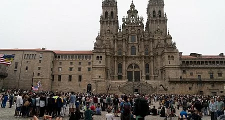 Crowd of pilgrims gathered at Obradoiro Square in front of the Santiago Cathedral_336