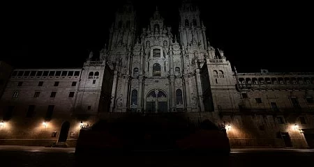 Full night view of the illuminated façade of the Santiago de Compostela Cathedral._338