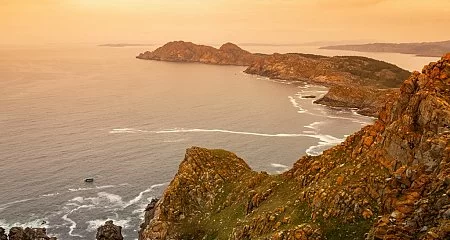 Sunset over the Cíes Islands with warm tones in the sky_5