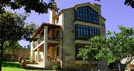 View of a historic pazo surrounded by nature in Galicia._307