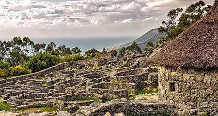 Well-preserved Celtic hillfort in northern Galicia surrounded by mountains._154